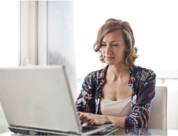 image of a woman using a laptop